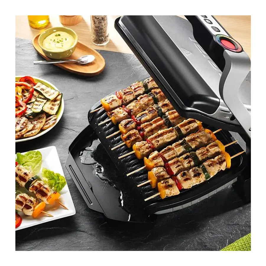 Električni roštilj Tefal OptiGrill GC706D34 od Omega s pločama za ravno i valovito pečenje, prikazan na slici